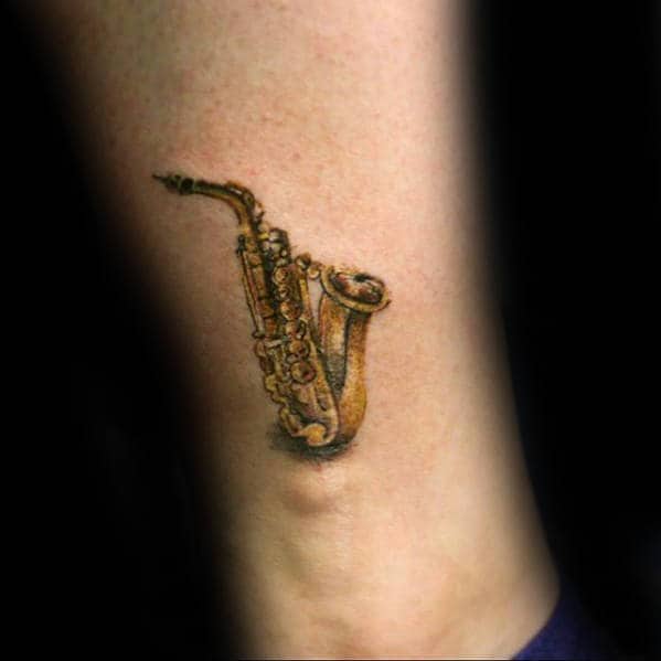 Small Guys Saxophone Lower Leg Tattoo