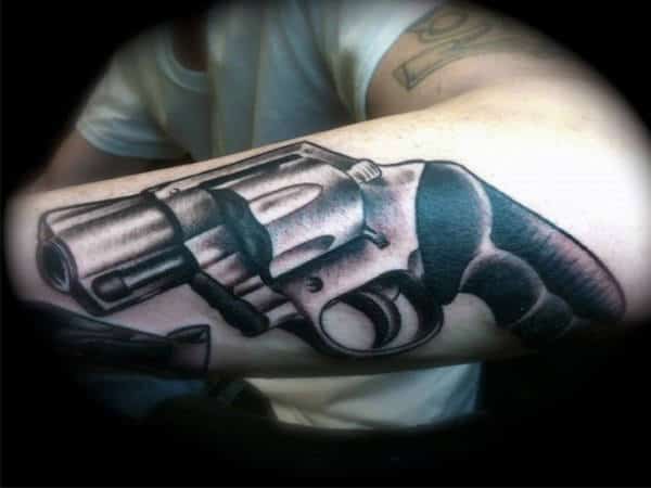 Small Handgun Man Tattoo On Arm
