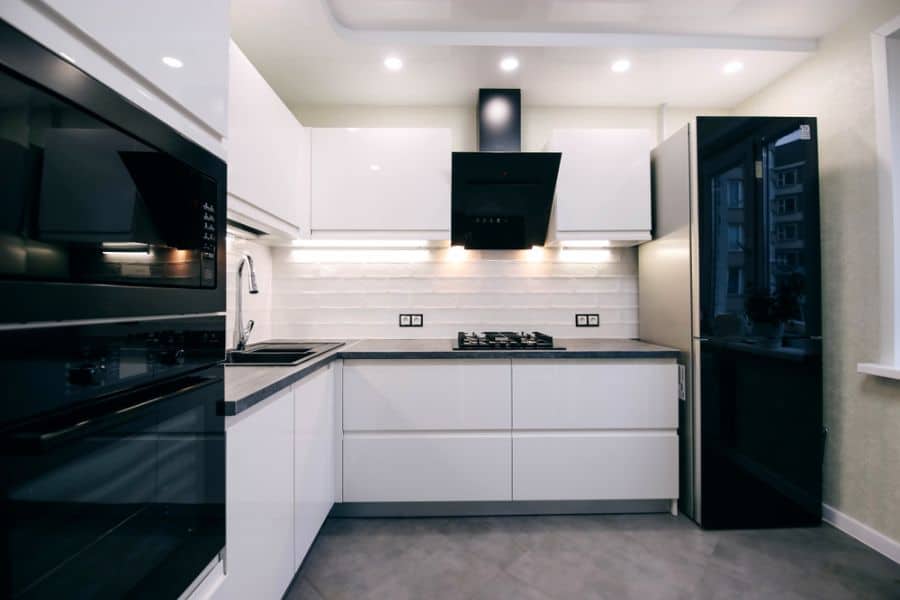 small black and white kitchen concrete floor