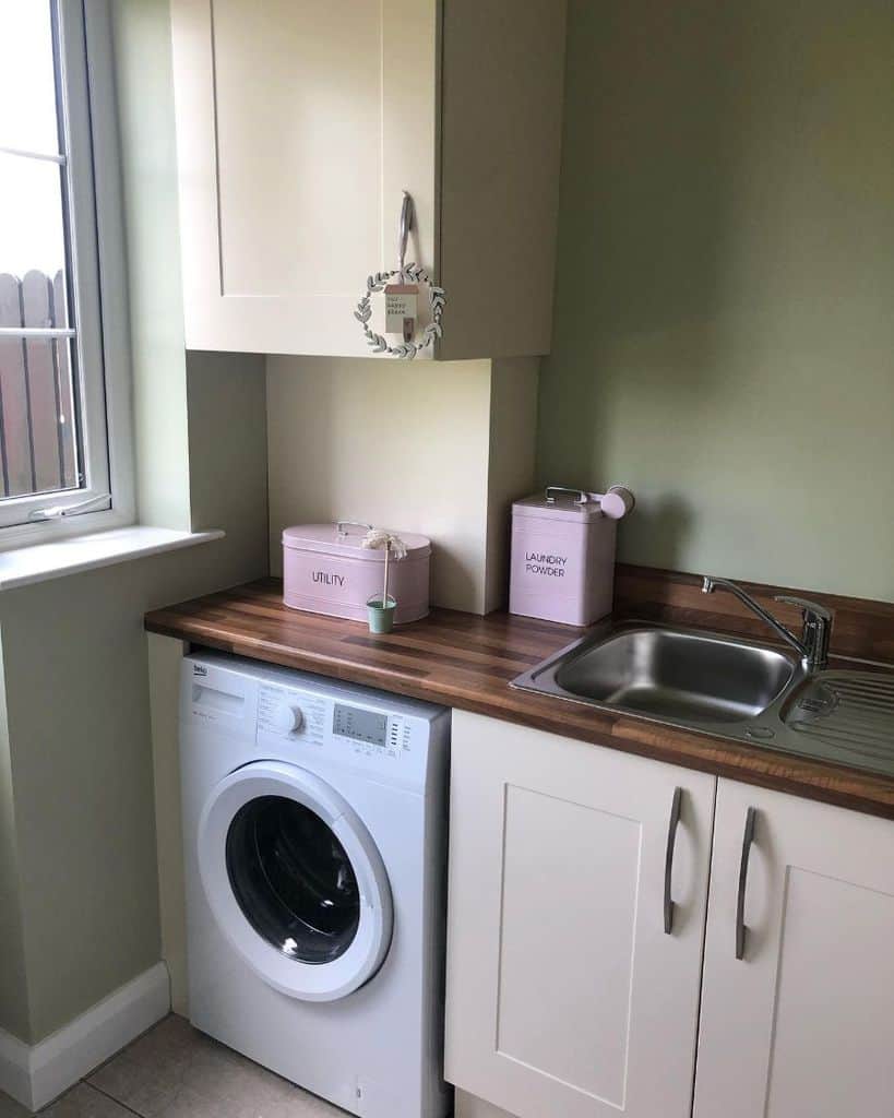 small green laundry white cabinets 