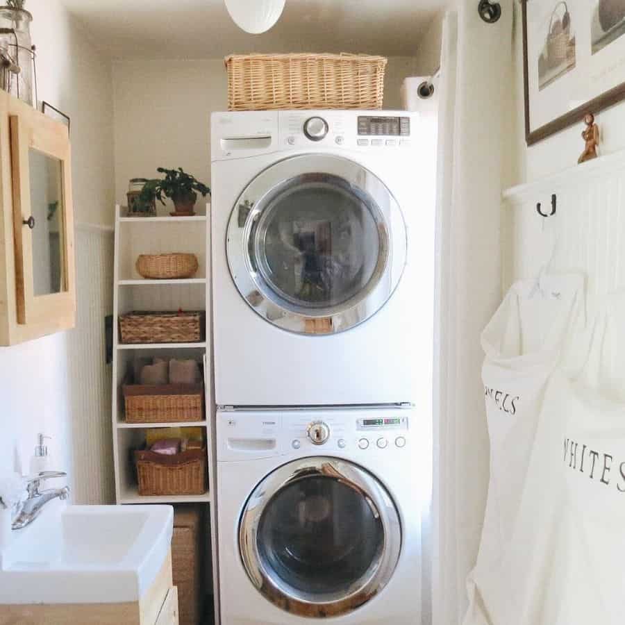 small laundry room stacked vertical washer and dryer basket storage