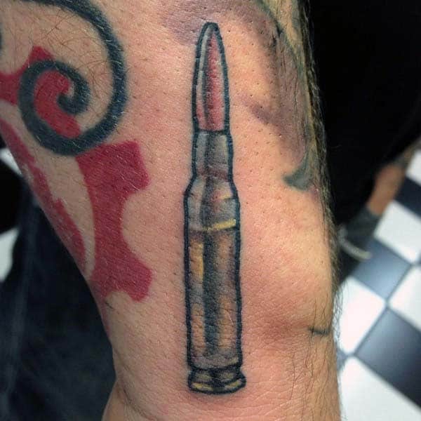 Small Mens Bullet Tattoo Above Wrist