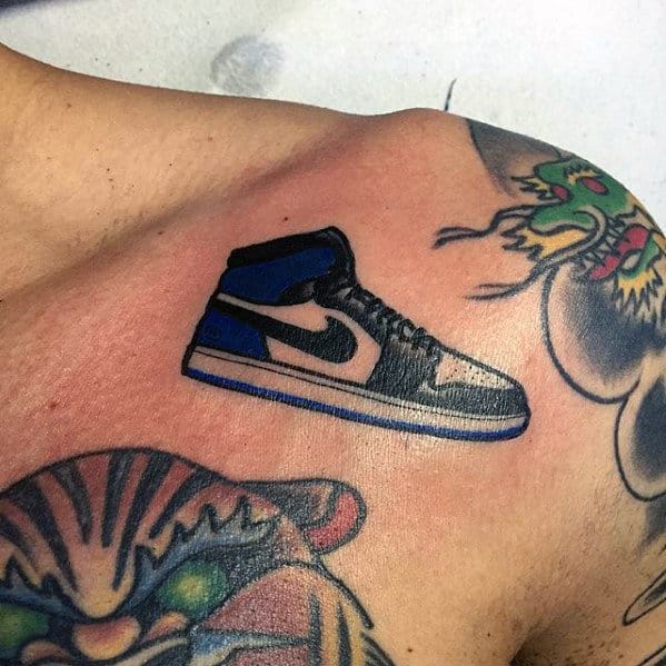 Small Mens Jordan Nike Shoe Tattoo On Upper Shoulder