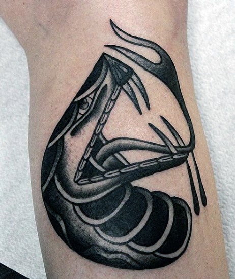 Small Men's Snake Eyes Tattoo On Wrist