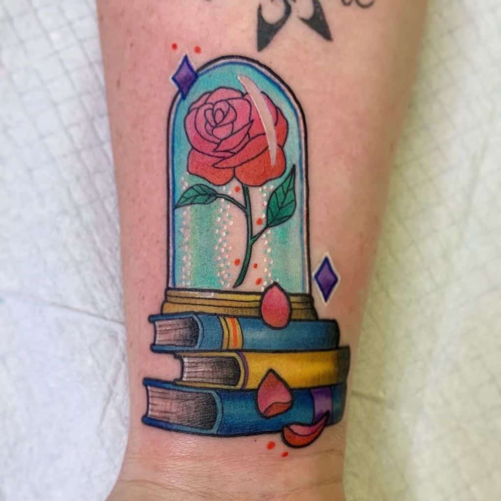 small minimalist beauty and the beast rose tattoos mindy_fach_tattoo