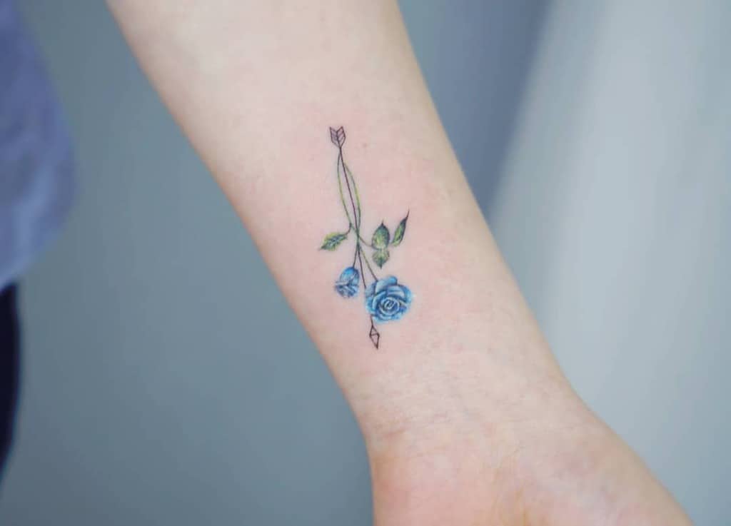 small minimalist blue rose tattoos mj_tattooer
