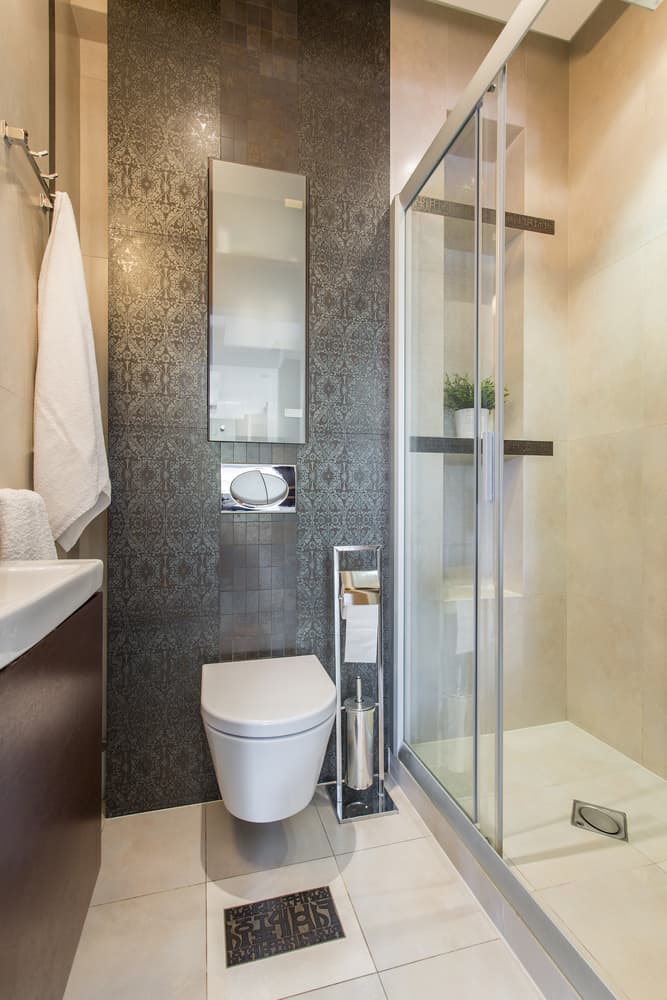 guest bathroom intricate tile design walk-in shower 