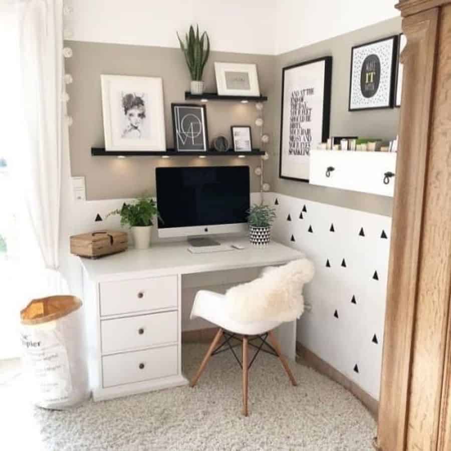 small corner office space bedroom two tone wall white desk with draws white chair framed wall art 