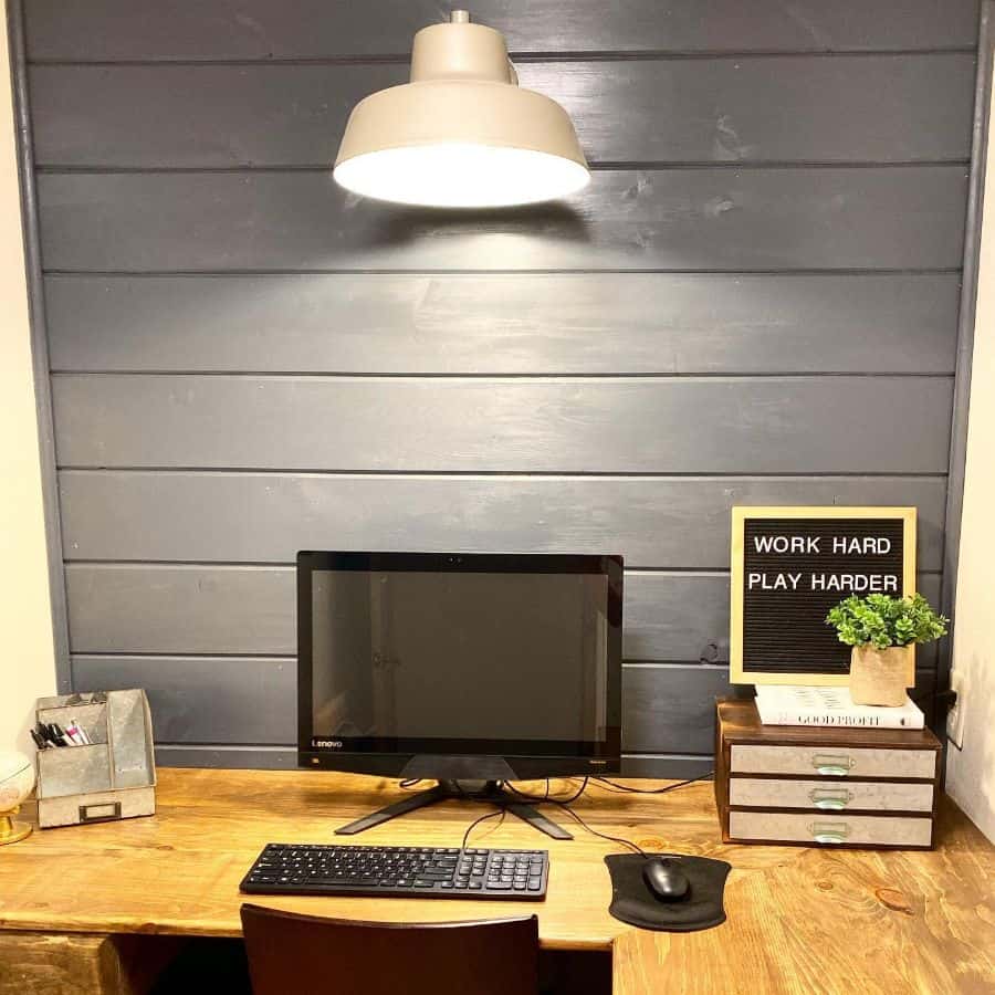 small home office space gray shiplap walls wood corner desk 