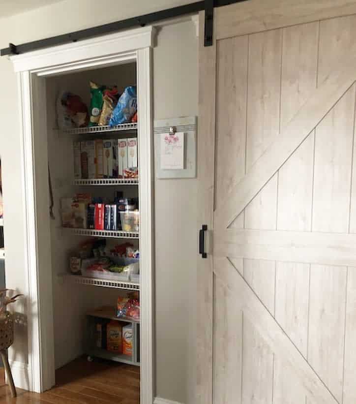small pantry with sliding barn door