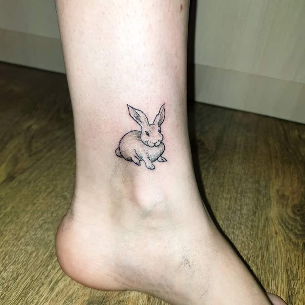 Minimalistic bunny and horse tattoo done in fine line