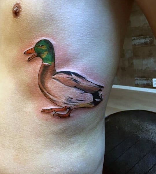 Small Realistic Duck Illustrative Side Of Ribcage Tattoo On Male