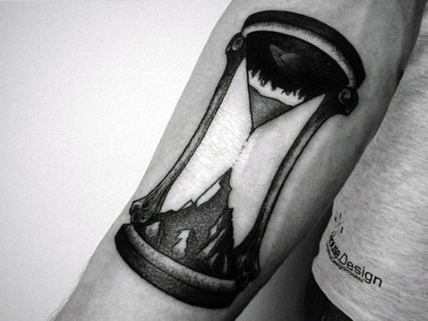 Small Simple Black Ink Mountain Top Hourglass Mens Tattoo On Arm