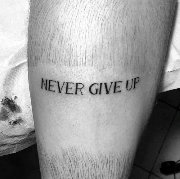 Small Simple Strength Tattoo With Never Give Up Lettering For Men
