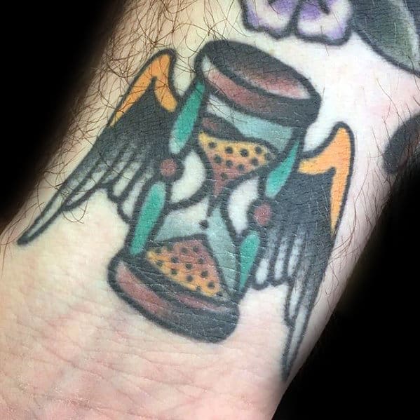 Small Simple Traditional Hourglass With Angel Wings Mens Wrist Tattoo