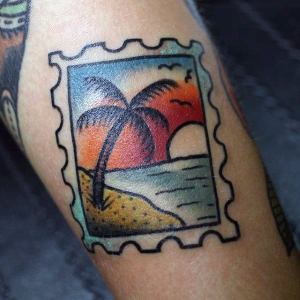 Small Simple Travel Tattoo Of Stamp With Palm Tree And Ocean Sunset Design On Man