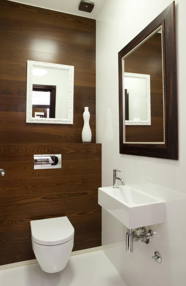 elegant bathroom with wood panel feature wall 