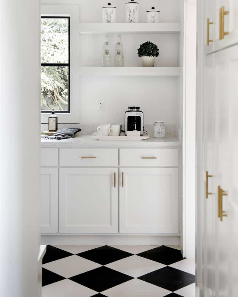 white butler's pantry gold accents black and white tile floor