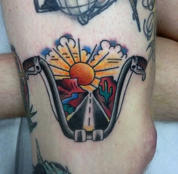 Small Traditional Biker Tattoos Handlebars With Sunset And Open Road On Man