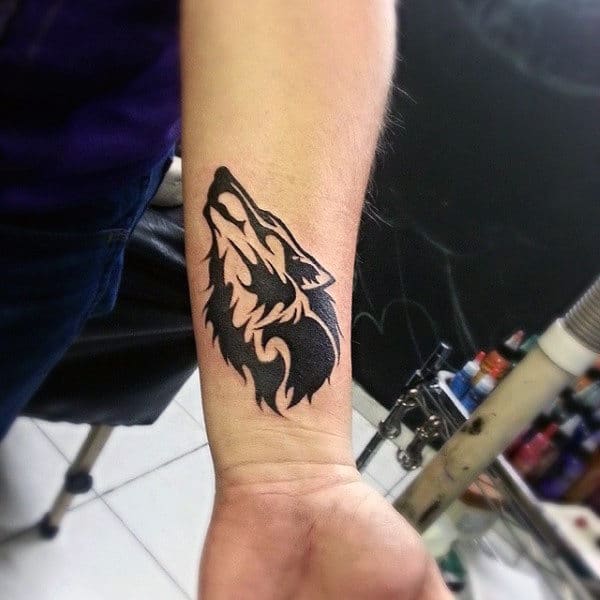 Small Tribal Wolf Wrist Mens Tattoos