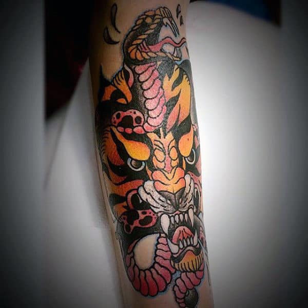 Snake And Angry Tiger Mens Traditional Forearm Tattoo Ideas