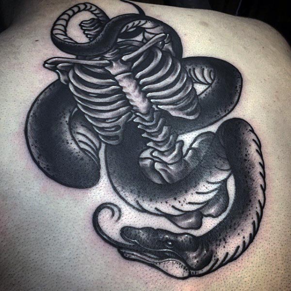 Snake Wrapped Around Skeleton Bones Mens Back Tattoo.