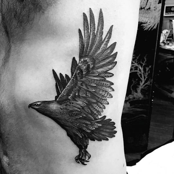 Snall Shaded Hawk Tattoo On Male Ribs