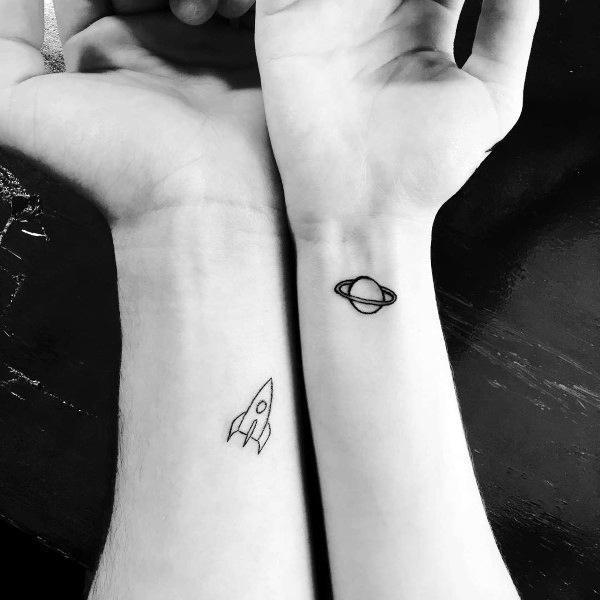 Spaceship And Saturn Couples Tattoos On Forearm And Wrist