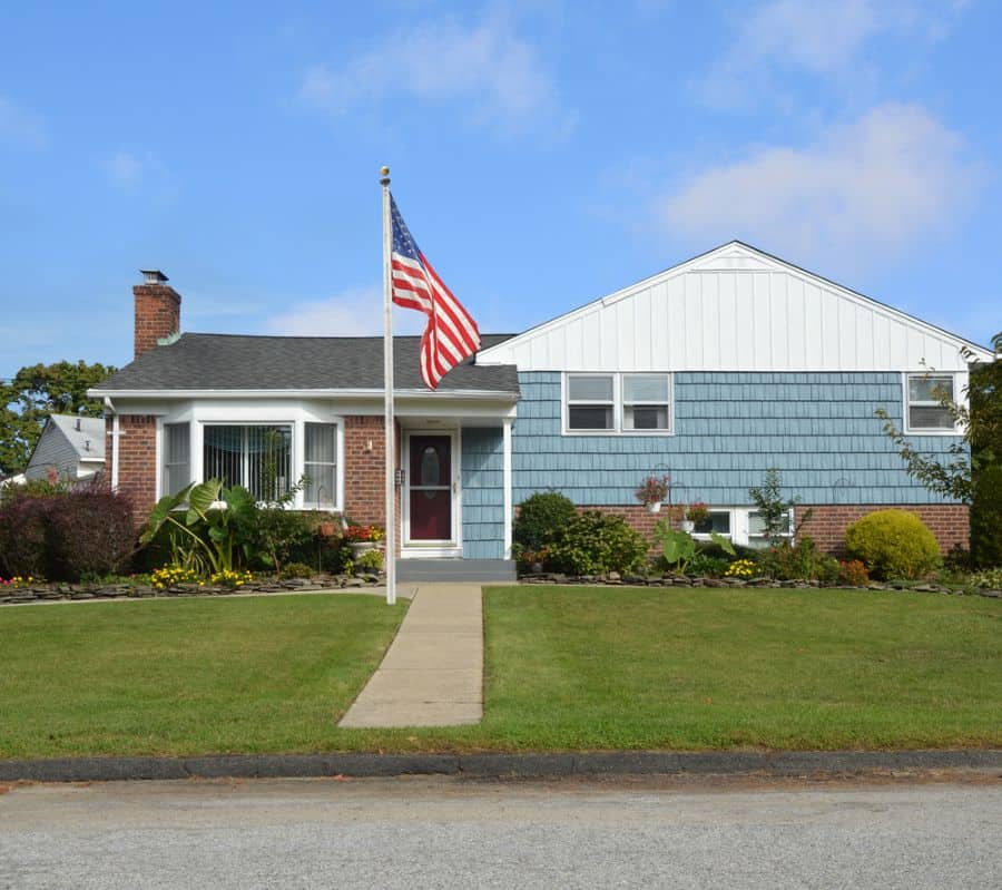 split-level house with american flag out front 