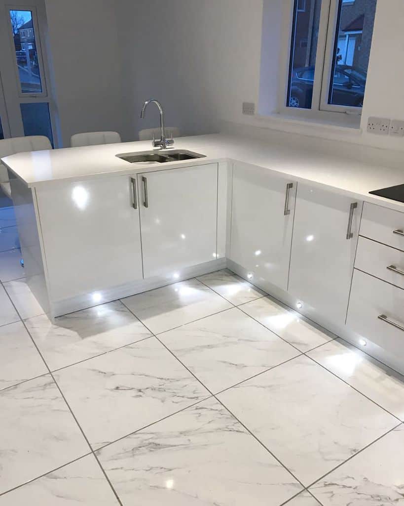 glossy marble floor tiles white cabinets with led lighting 