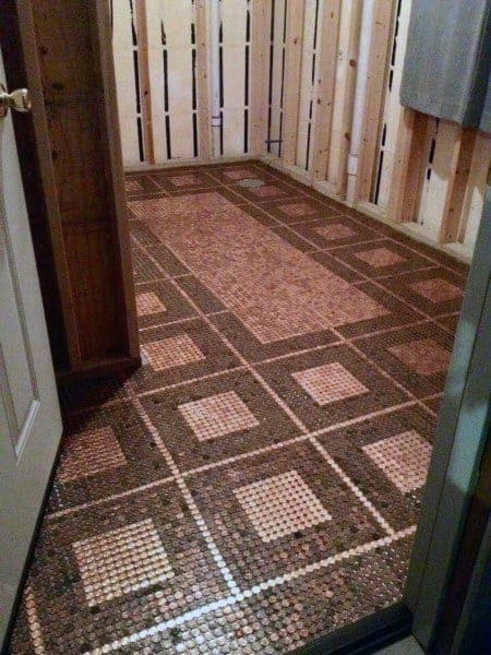 Rustic room with a geometric penny floor design and square accents.