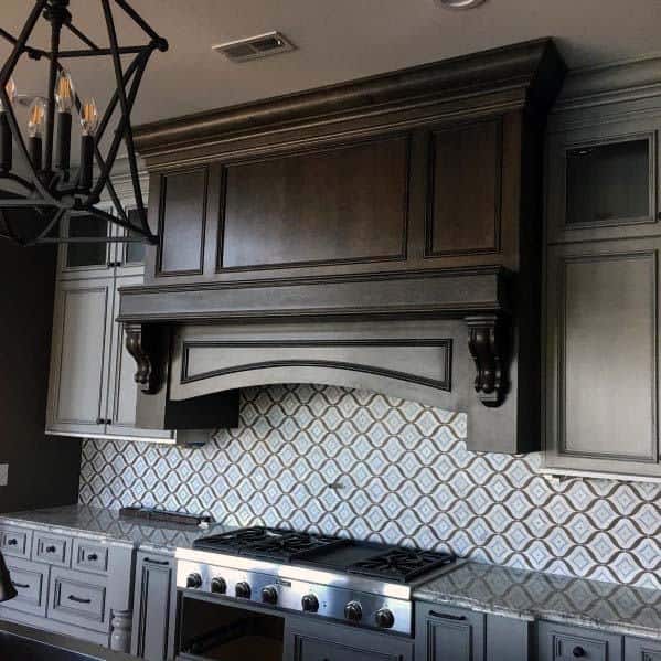 large brown wood hood in kitchen 