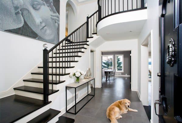 luxury home with black and white staircase 