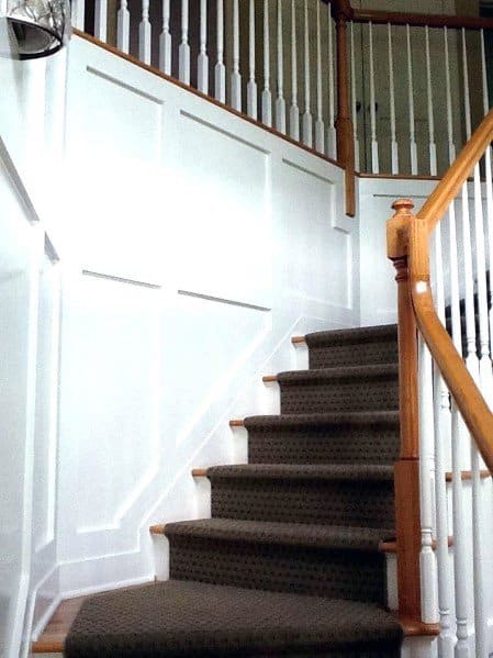 brown carpet on traditional staircase 