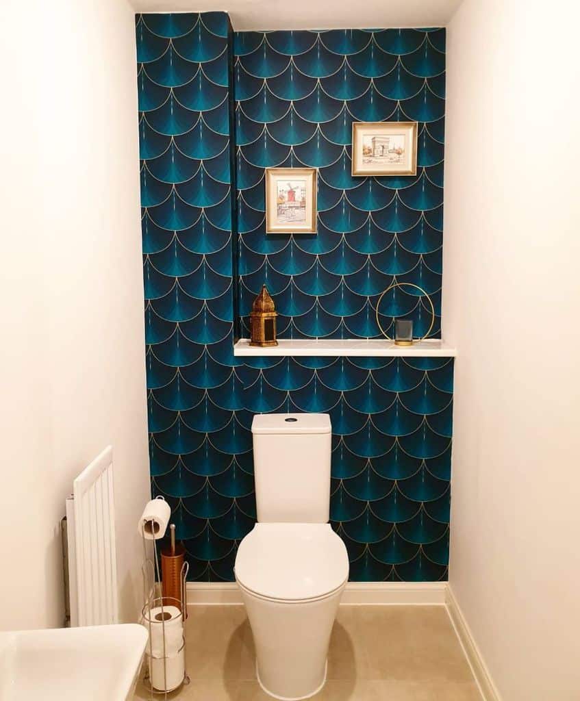 small bathroom with blue pattern statement wall