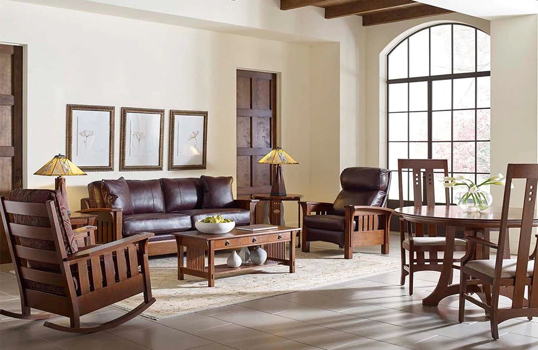 Classic living room with leather sofa, wooden furniture, rocking chair, and craftsman-style decor.