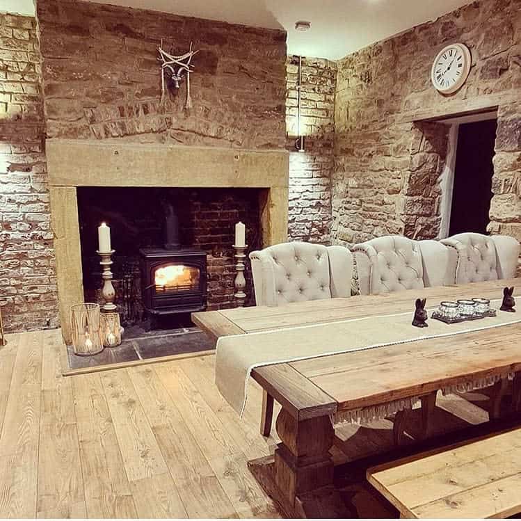 stone wall dinning room with fireplace