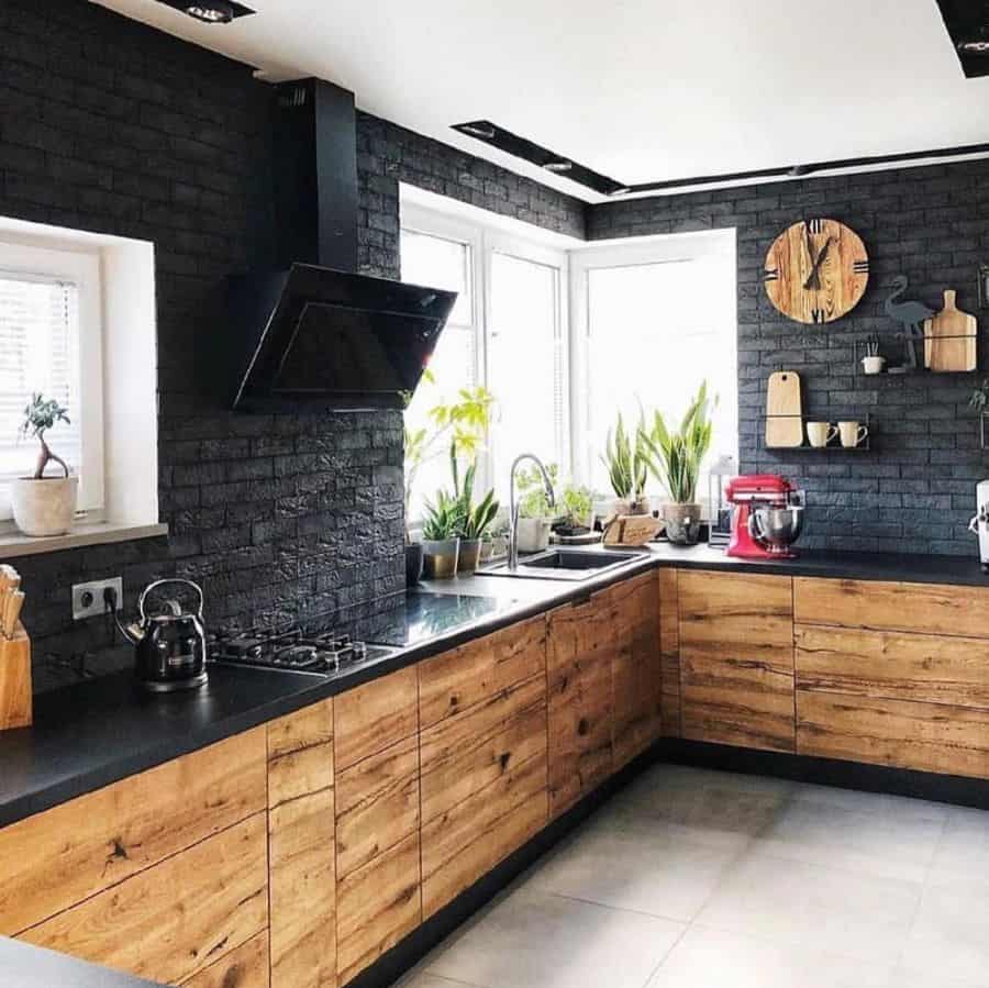 rustic kitchen painted black brick walls wood cabinets gray slab floor tiles