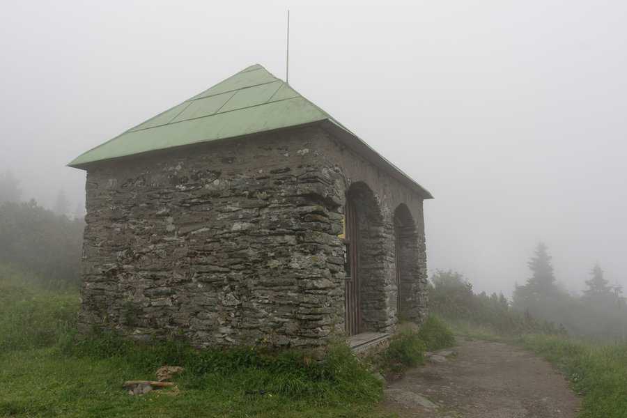 stone shed with green roof