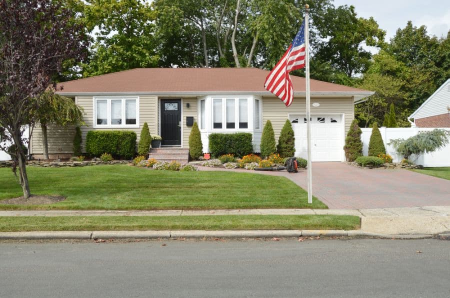 american flag outside suburban house
