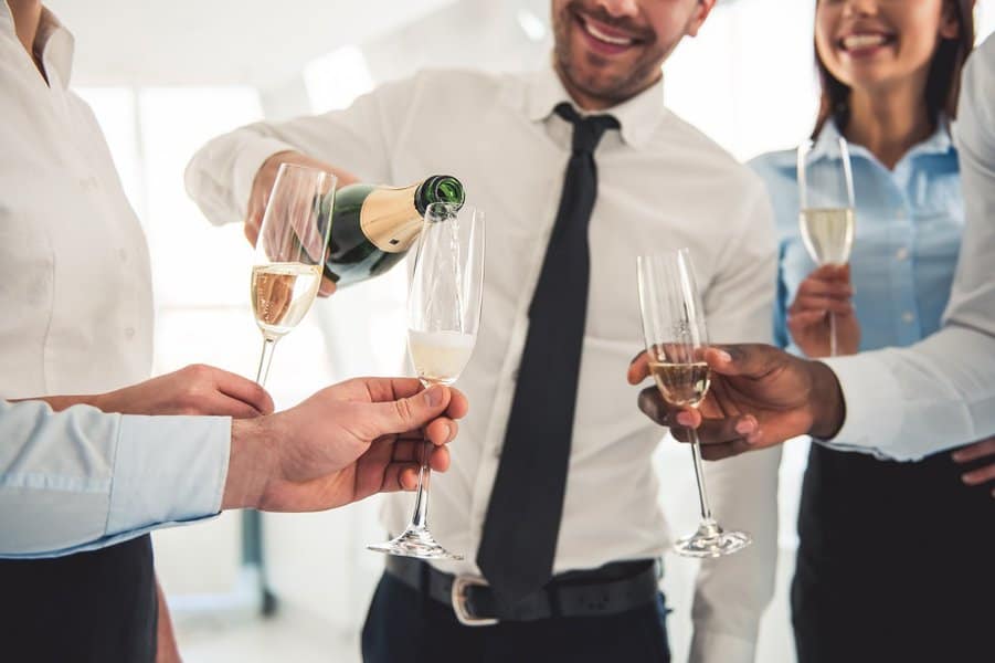successful business people drinking champagne