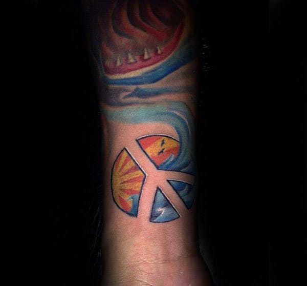 Sun Rays With Ocean Water Peace Sign Forearm Tattoo For Gentlemen