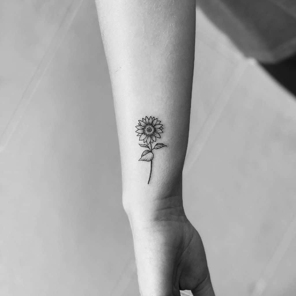 sunflower flower wrist tattoo kamilarthurtattoo