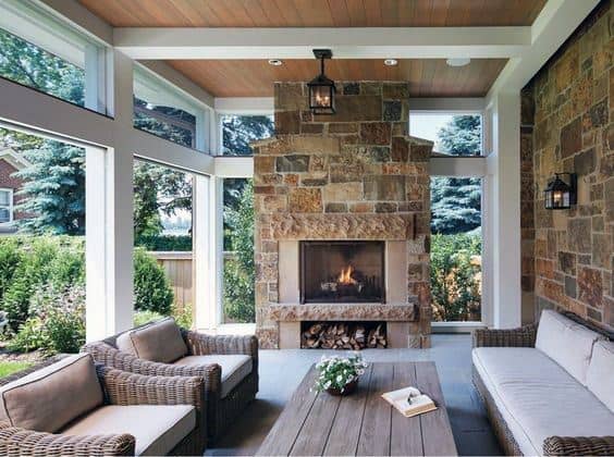 stone fireplace sunroom