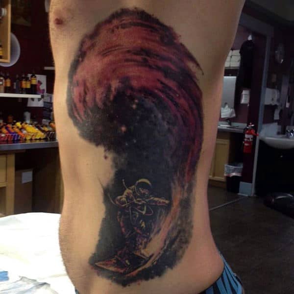 Surfing Through The Space Astronaut Tattoo Guys Side Rib