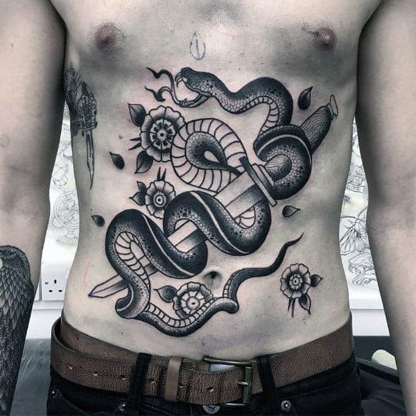 sword-with-snake-and-flowers-mens-traditional-black-ink-shaded-chest-tattoo-ideas