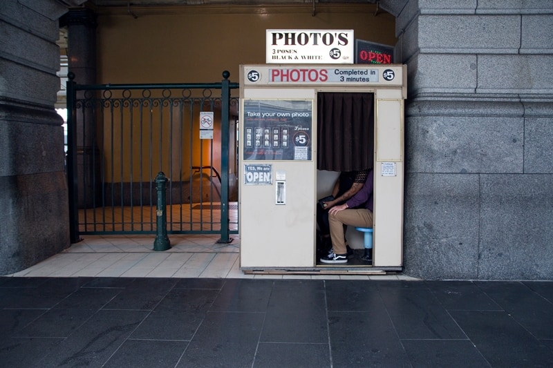 take photos at a photobooth rainy day date ideas
