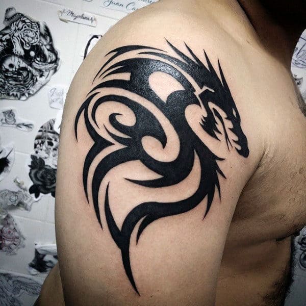 Timeless Elegance Meets Raw Power: The Tribal Dragon Tattoo — LuckyFish,  Inc. and Tattoo Santa Barbara