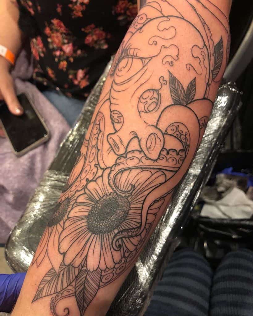 Unfinished forearm tattoo octopus with daisy and leaves