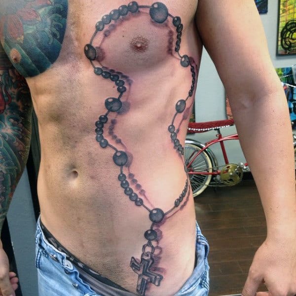 Tattoo Rosary On Male Rib Cage And Chest With Beads